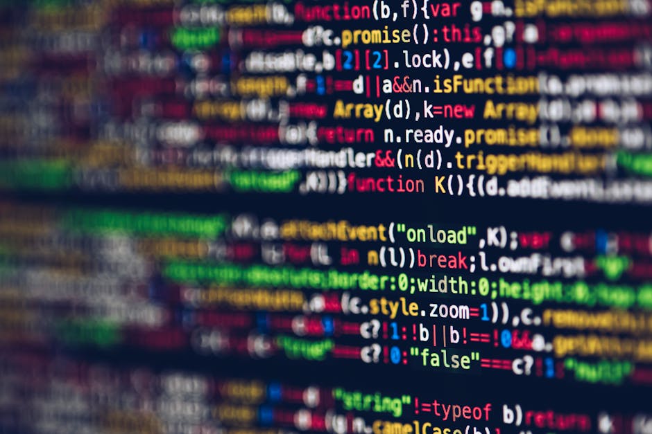 A close-up view of a computer screen displaying lines of colorful programming code, including syntax in red, green, blue, and yellow, with words like 'function', 'var', and 'style' visible. The text i